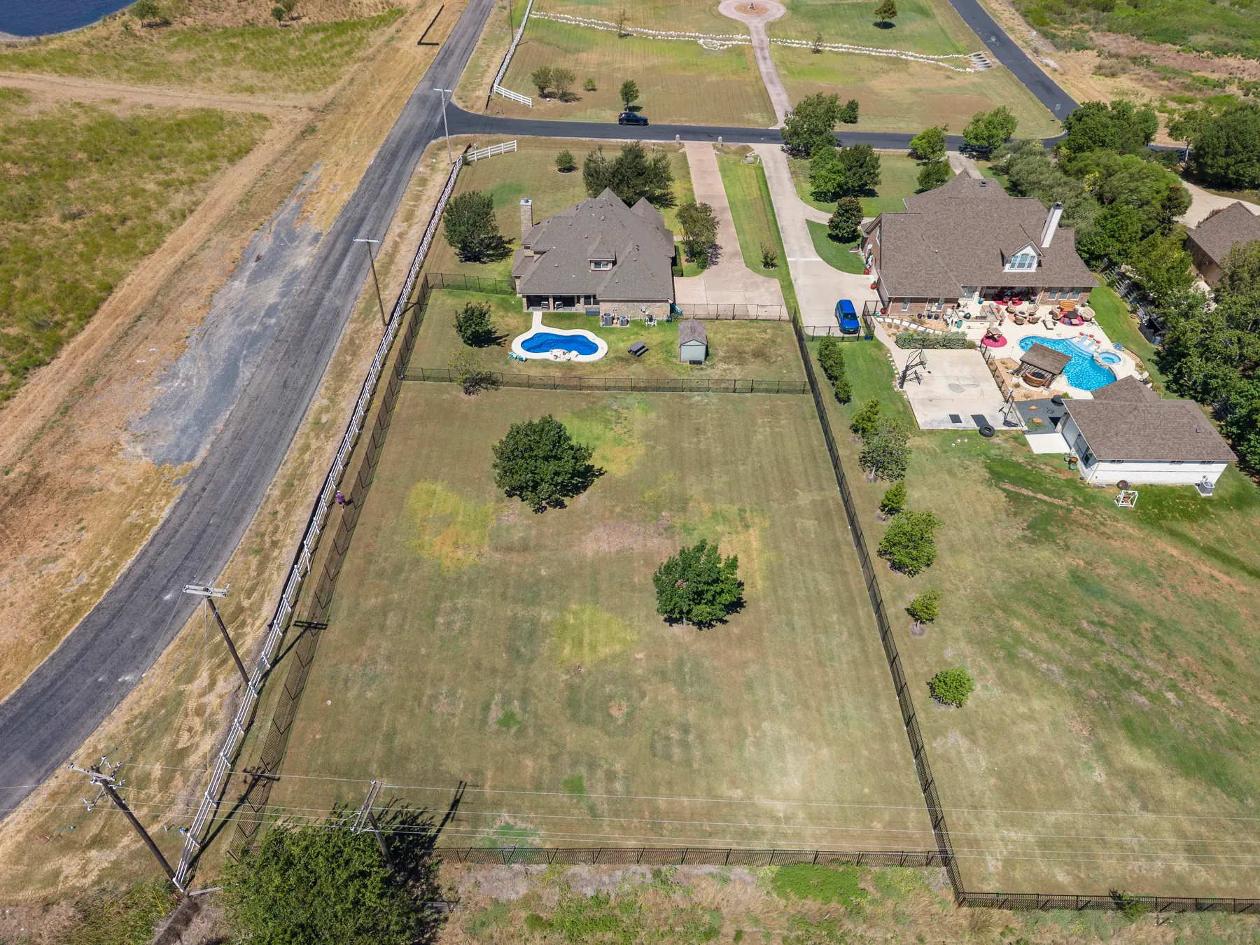 High aerial showing the full property context