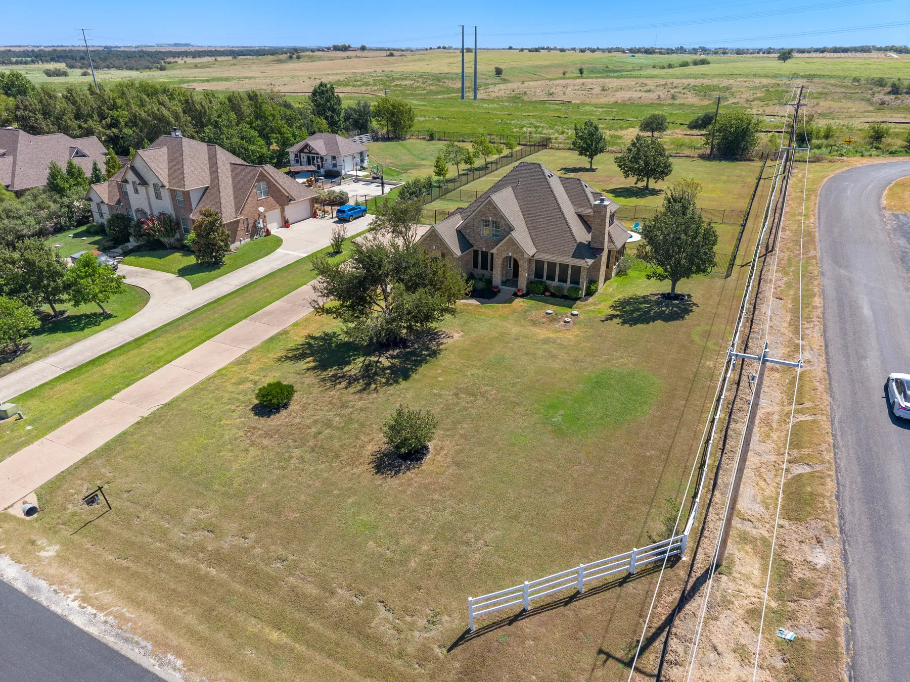 Aerial establishing view of the home and lot