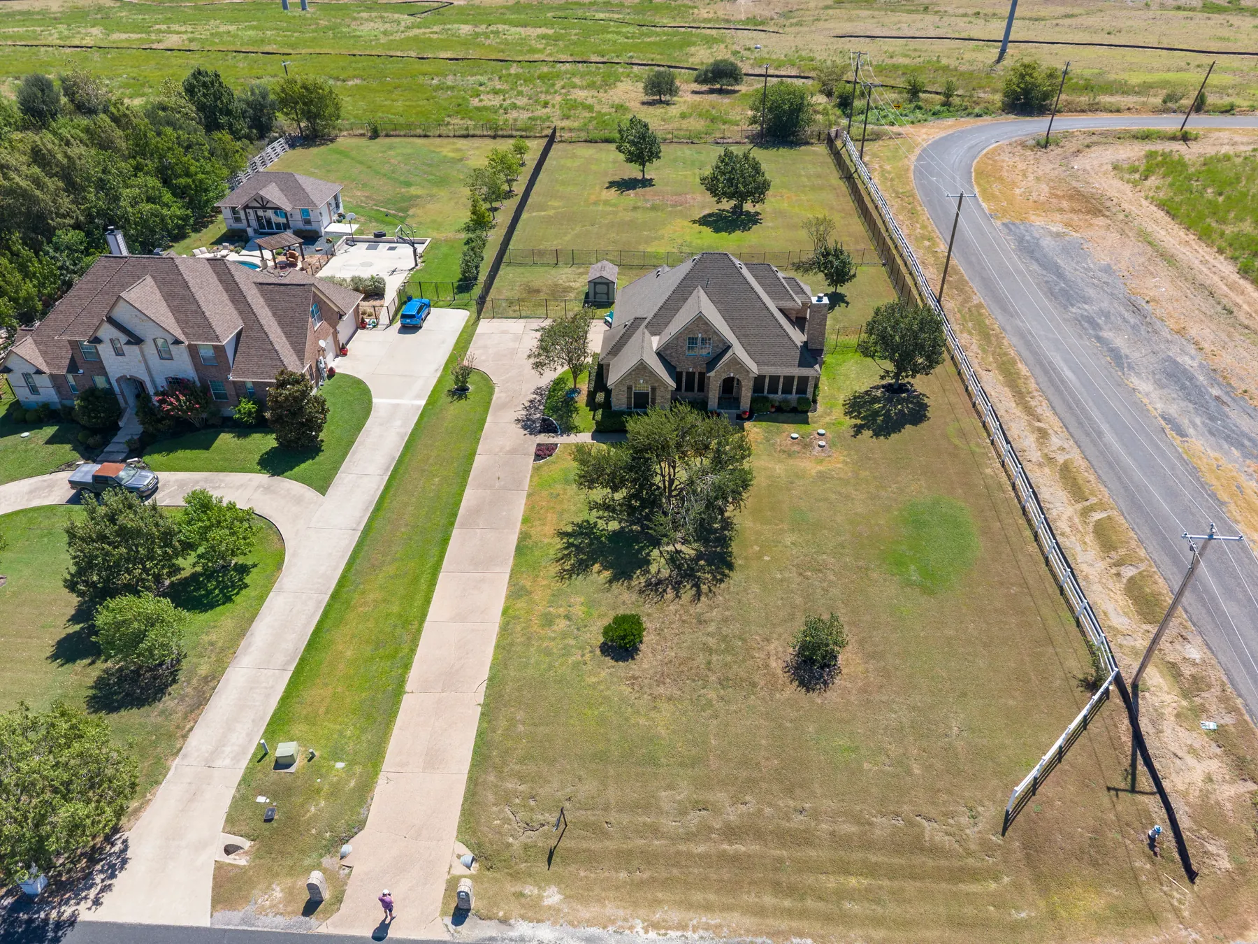 Aerial view along the front drive and lawn