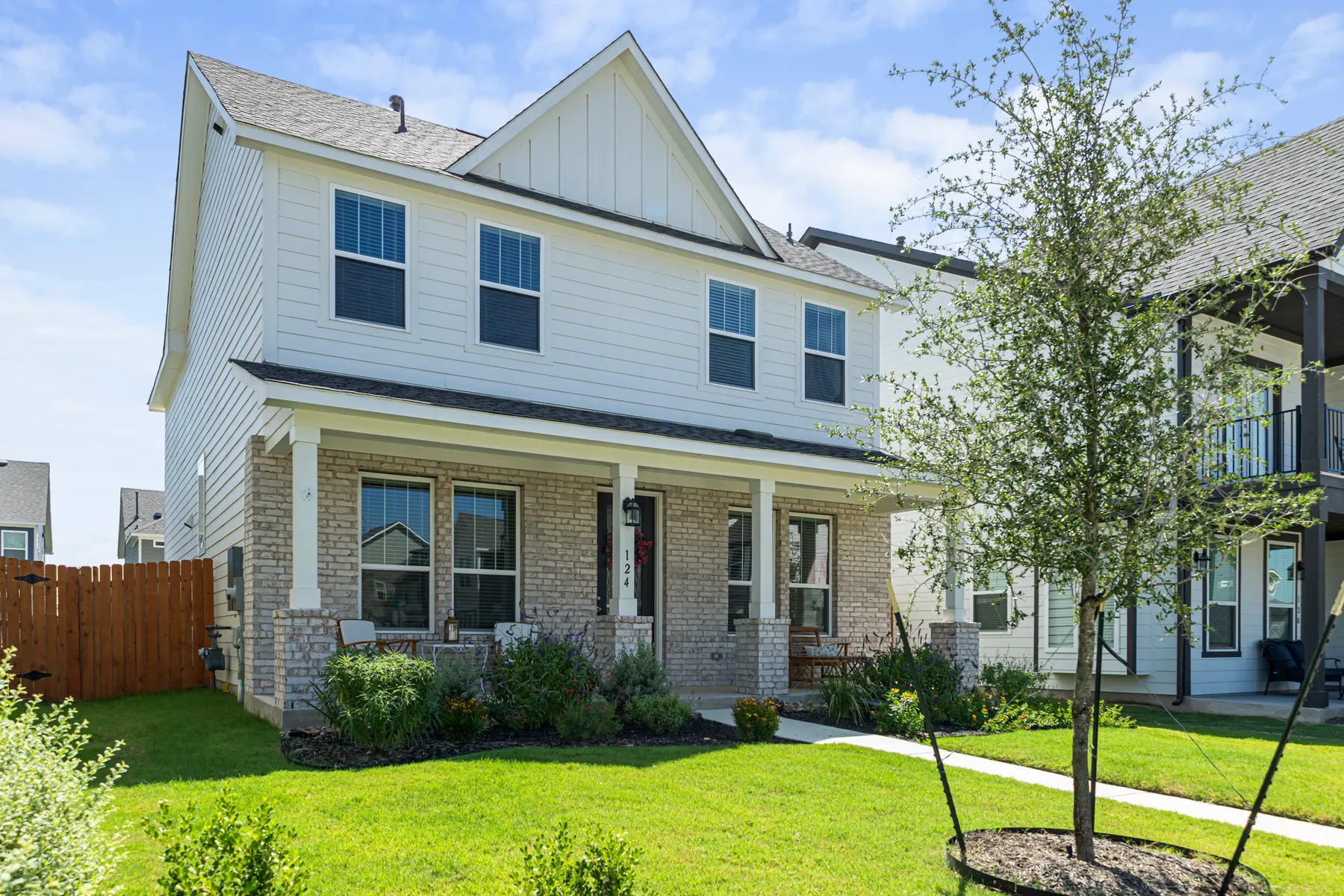 Angled front exterior and landscaped yard
