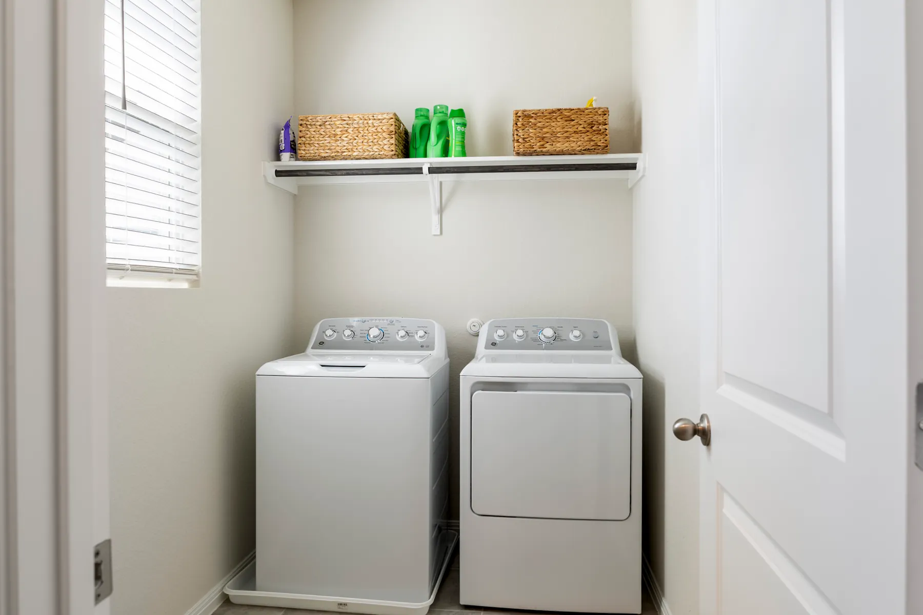 Laundry room with side-by-side appliances