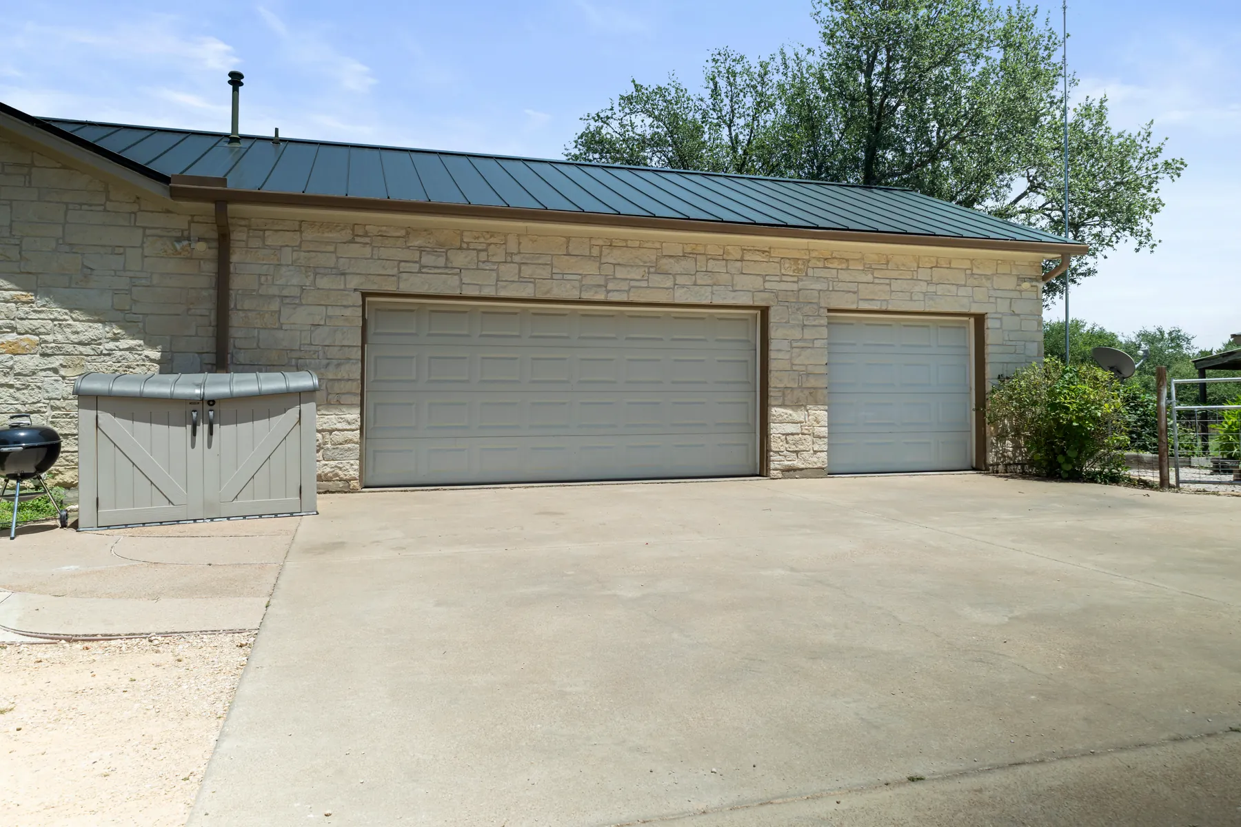 Detached stone garage and paved approach