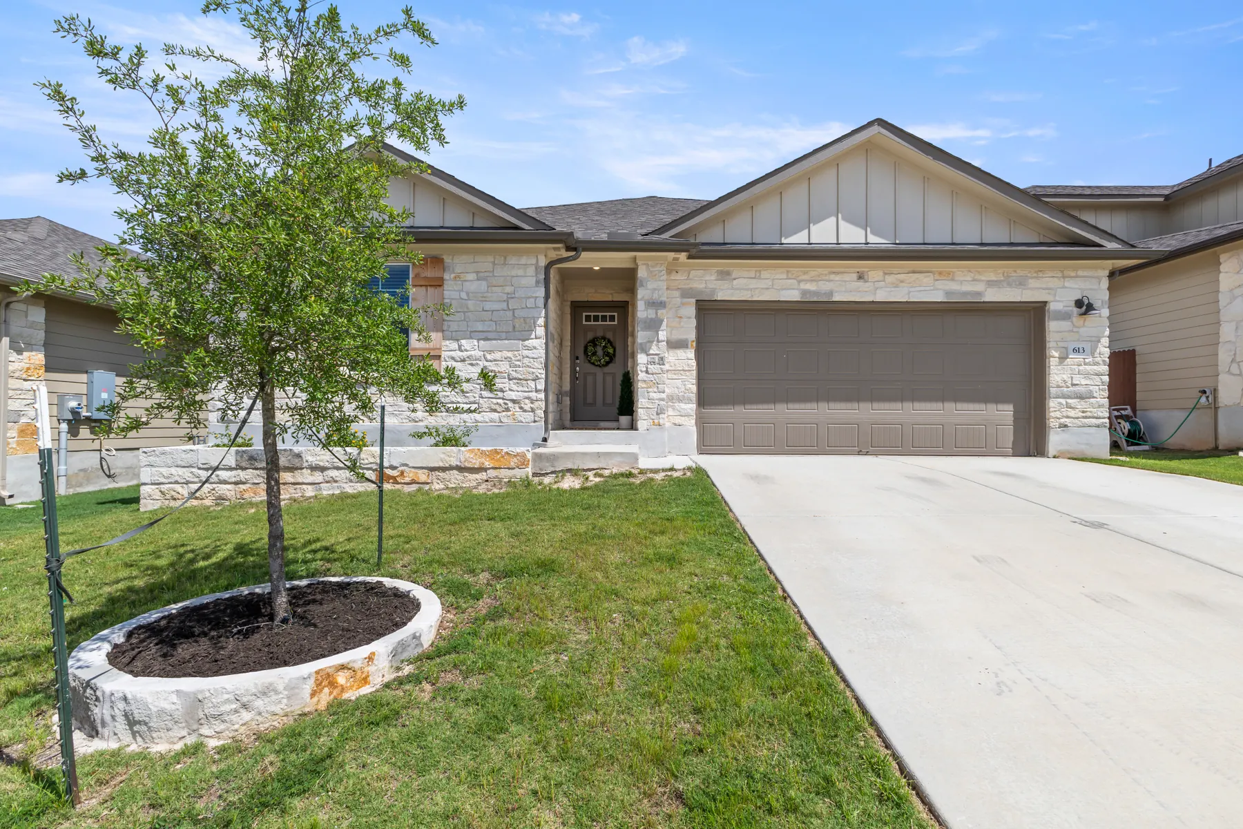 Front exterior of 613 Wildspur Dr